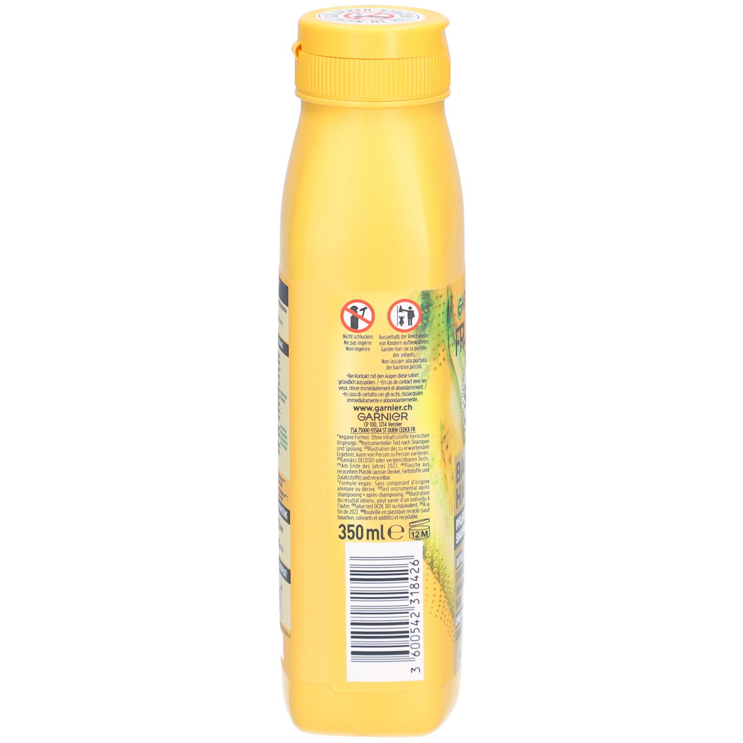 Dos du flacon de shampooing jaune. Contient des informations et un code-barres. 350ml.