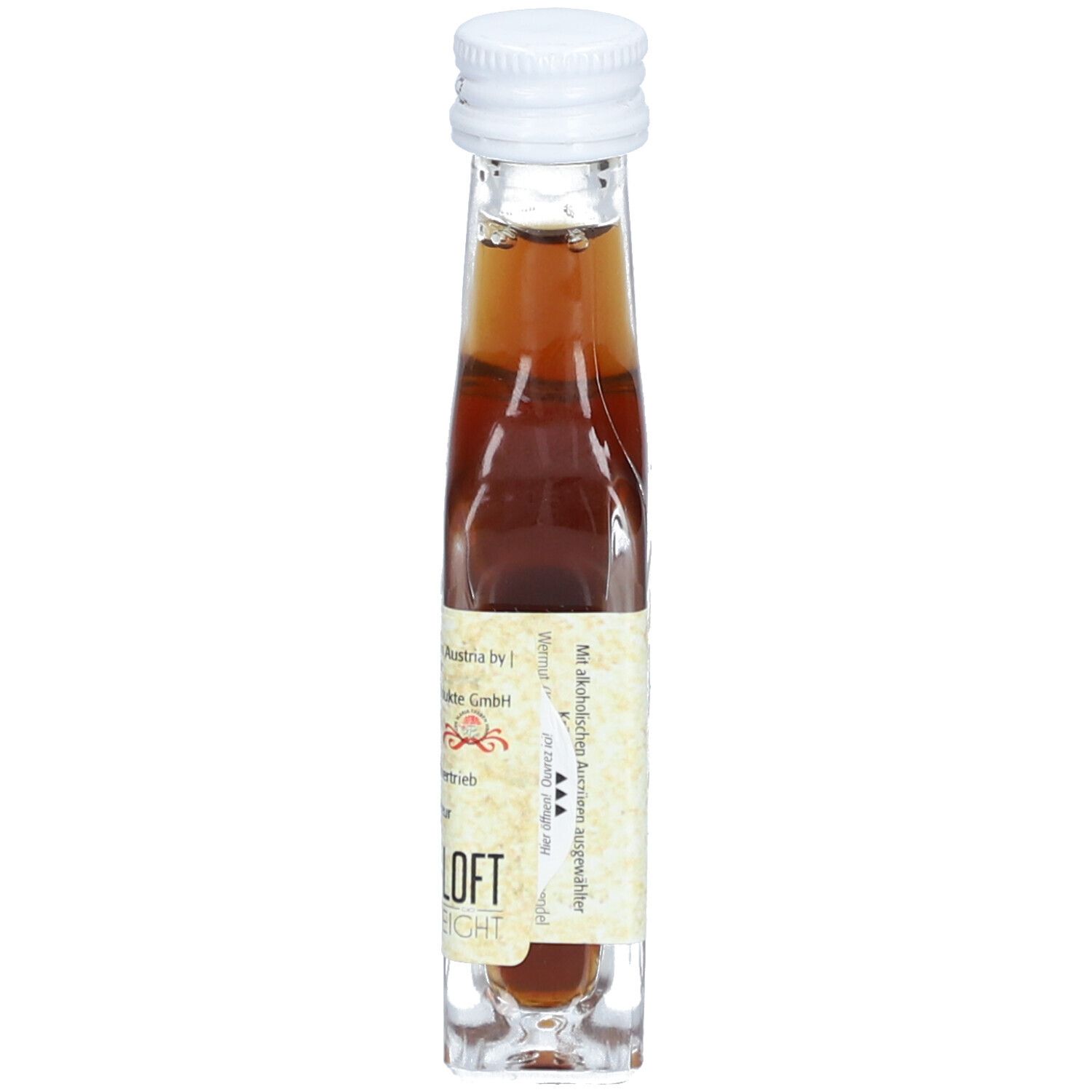 Petite bouteille en verre avec bouchon blanc. Étiquette avec texte. Liquide ambré visible.