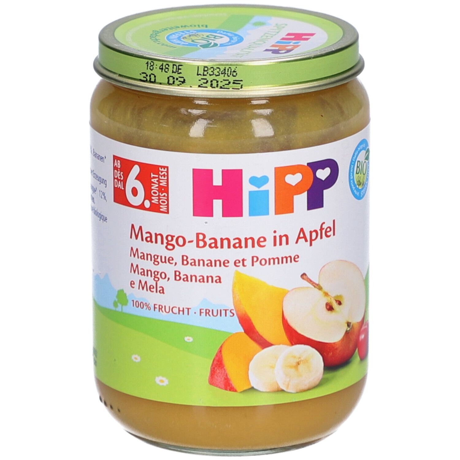 Pot de purée HiPP Bio Mangue-Banane-Pomme. Étiquette avec nom du produit, illustrations de fruits et label bio. Couvercle avec date de péremption.