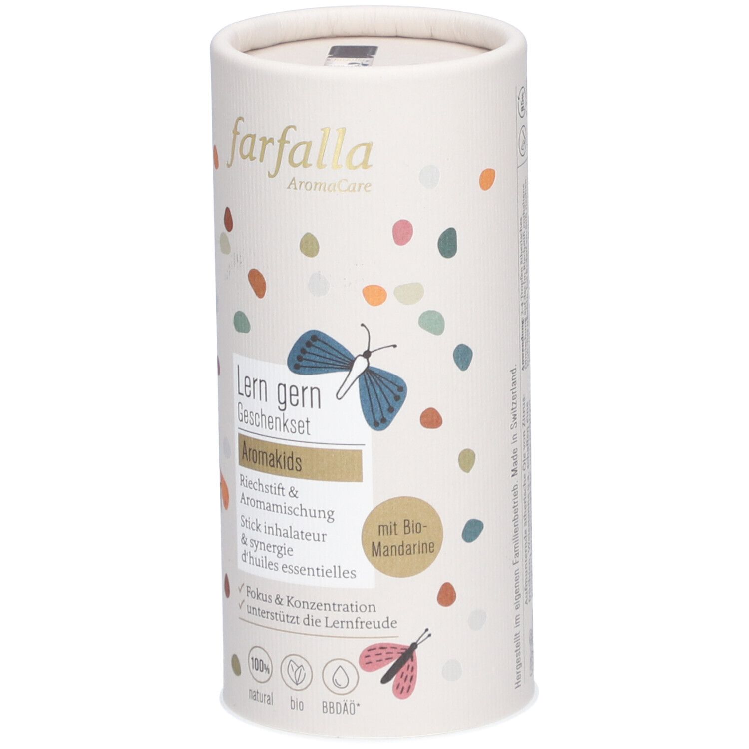 Zylindrische Verpackung, farfalla Aromakids. Aufschrift: Lern gern Geschenkset, Aromakids, Stick inhalateur. Mit Bio-Mandarine. Bunte Punkte.