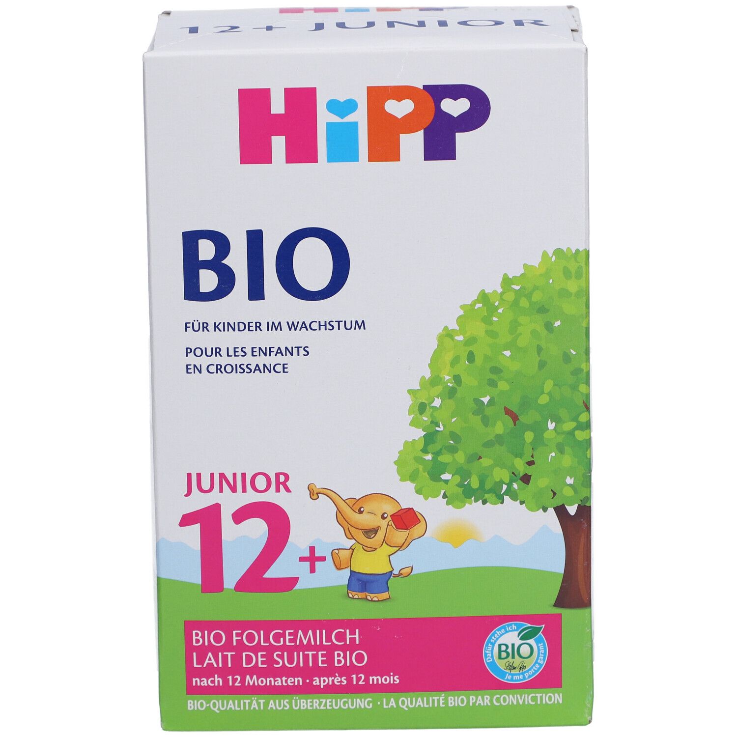 Boîte de lait de suite HIPP Bio Junior 12+. Qualité BIO, illustration d'arbre et d'éléphant. Texte : BIO, Junior 12+.