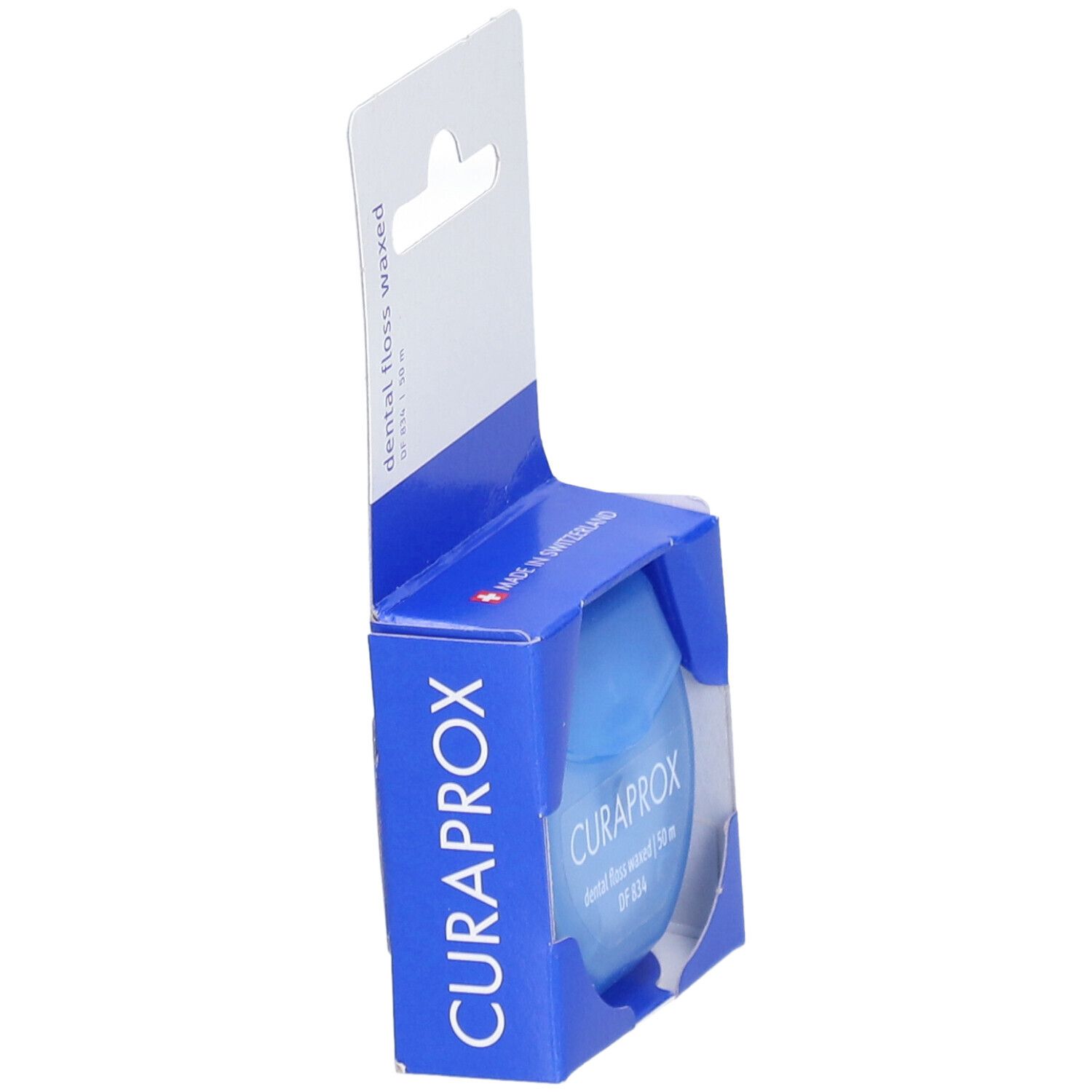 Emballage bleu avec fil dentaire. Marque CURAPROX, 50 m, ciré.