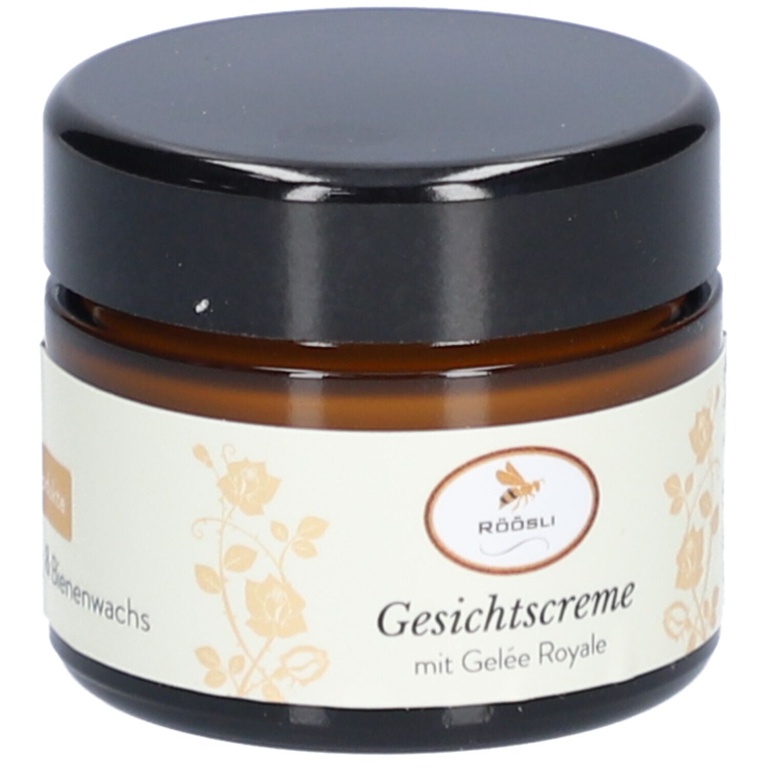 Braune Glasdose mit schwarzem Deckel. Etikett: Röösli, Gesichtscrème mit Gelée Royale, Honig & Bienenwachs.