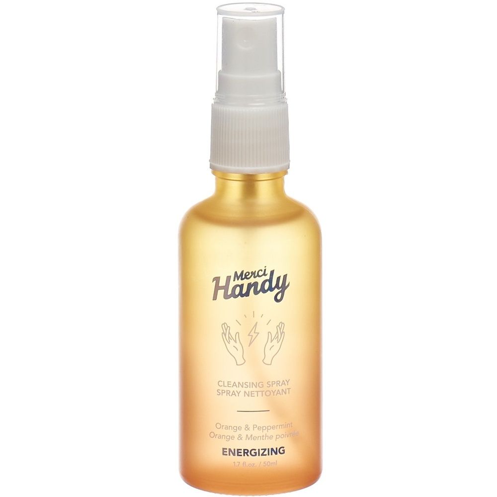 Gelb-oranges Spray mit weißem Sprühkopf. Aufschrift: Merci Handy, Cleansing Spray, Energizing. Hände-Symbol.