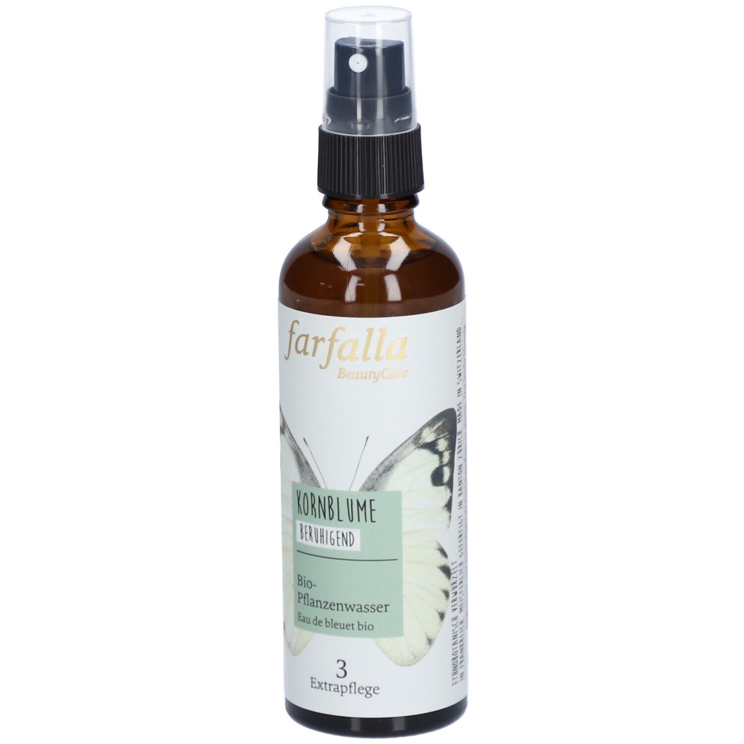 Braune Glasflasche mit Zerstäuber. Aufschrift: farfalla, Kornblume beruhigend, Bio-Pflanzenwasser. Schmetterlingsmotiv.