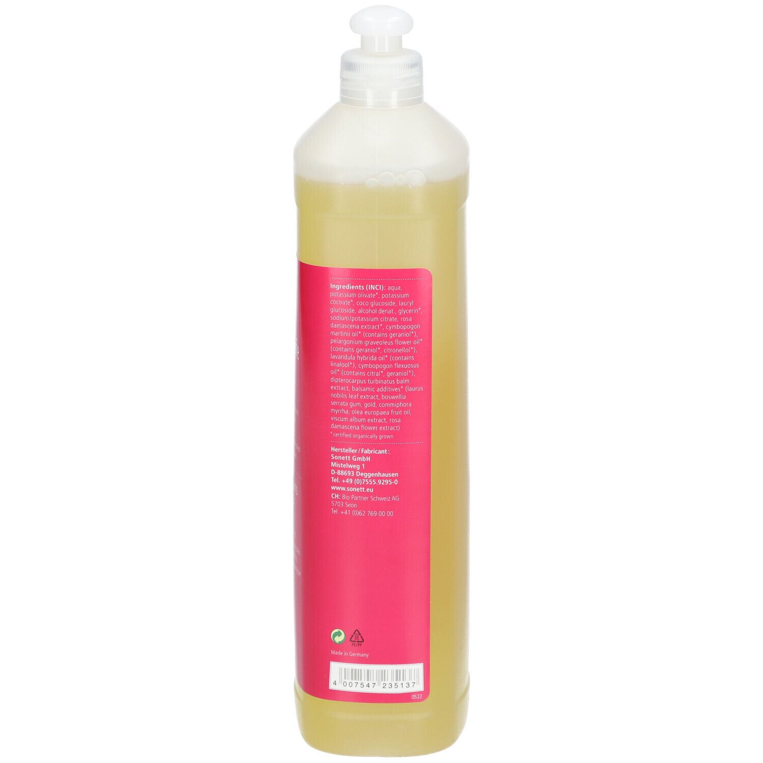 Dos du flacon de savon liquide. Étiquette rose avec texte. Liquide transparent.