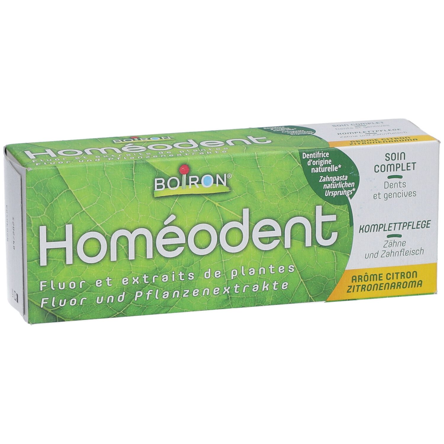 Homeodent-Zahnpasta-Verpackung. Text: Homeodent, Fluor und Pflanzenextrakte, Zitrone, 75 ml.