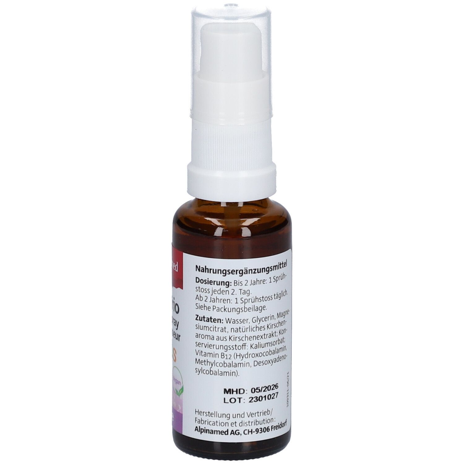 Braune Glasflasche mit weißem Sprühkopf. Aufschrift: B12 Trio Dosierspray Kids. Vegan-Siegel. Etikett mit Dosierung und MHD.