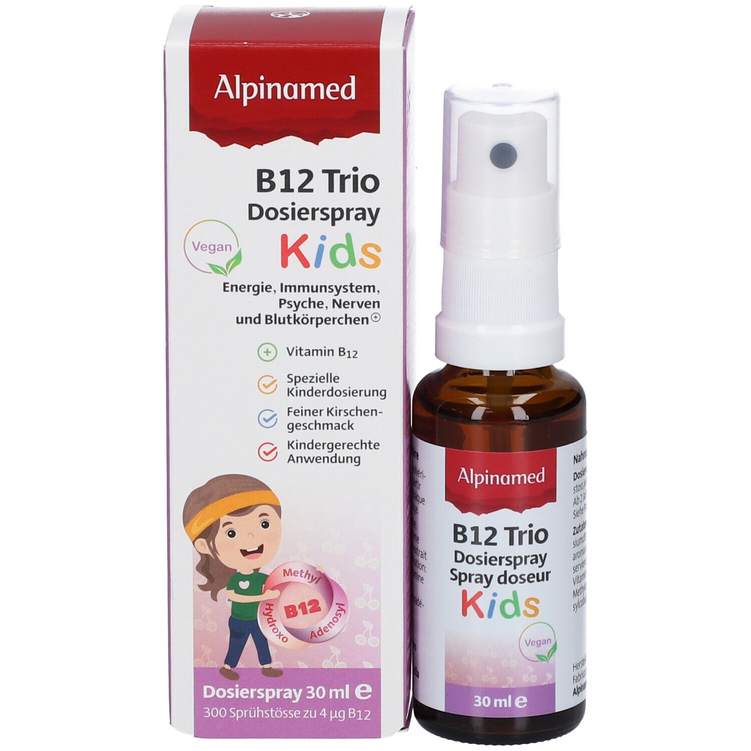 Produkt und Verpackung. B12 Trio Dosierspray Kids. Weiße Schachtel mit Produktabbildung und Text. Vegan-Siegel.