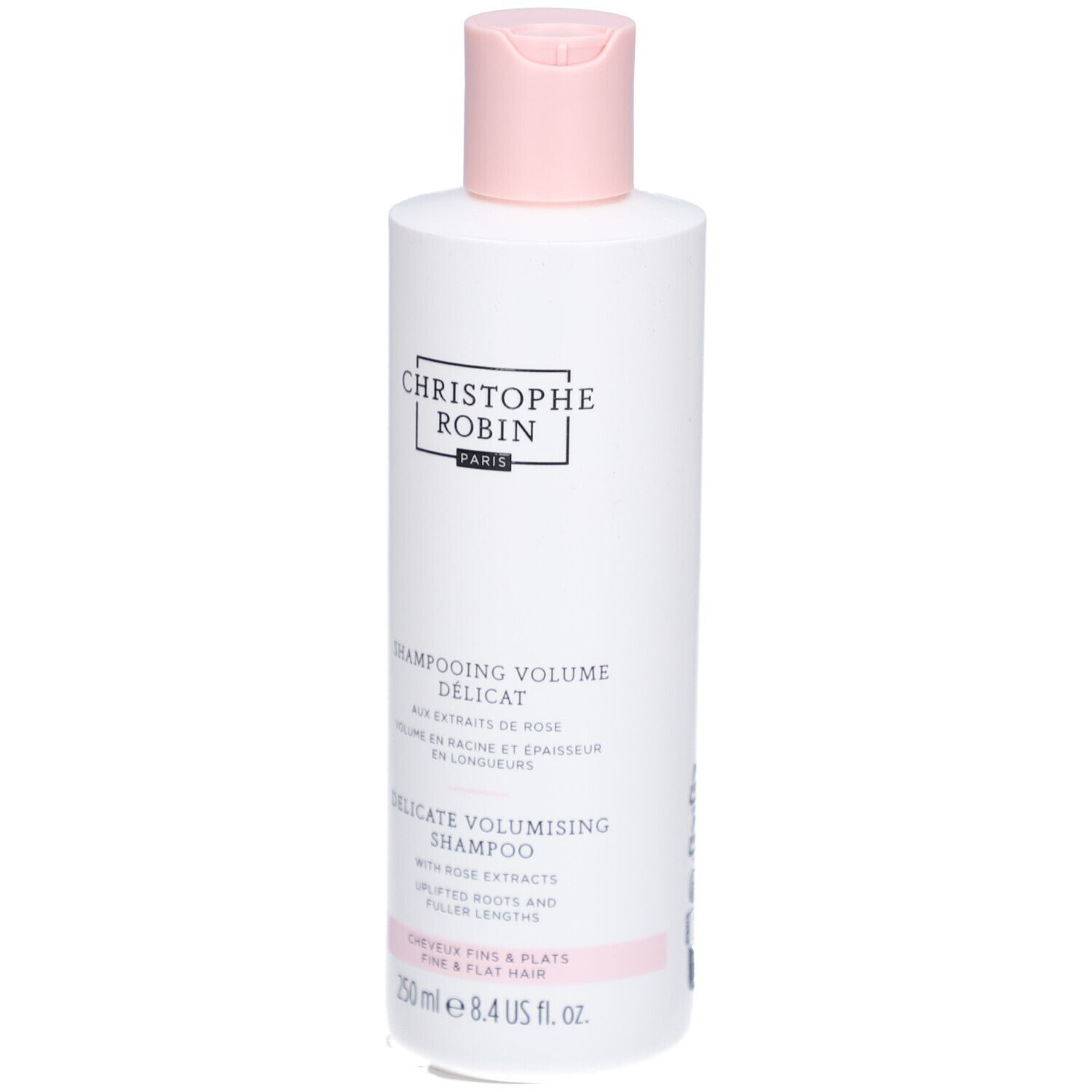 Weiße Shampoo-Flasche mit rosa Verschluss. Text: Christophe Robin, Shampooing Délicat Volume, 250 ml.