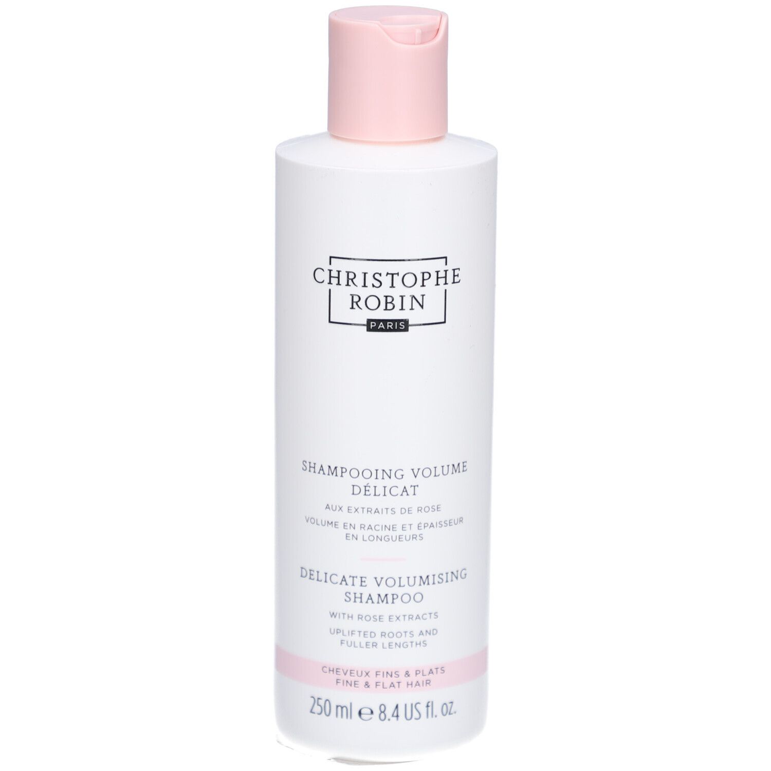 Weiße Shampoo-Flasche mit rosa Verschluss. Text: Christophe Robin, Shampooing Délicat Volume, 250 ml.