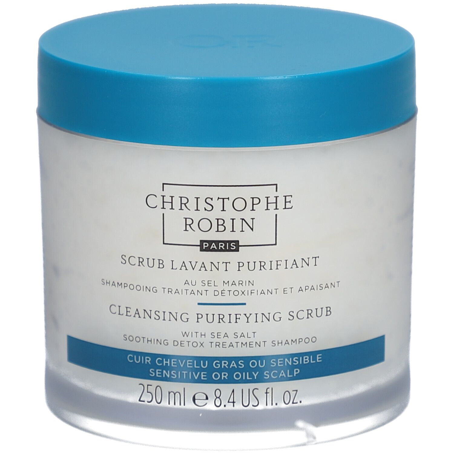 Runde Dose mit blauem Deckel. Aufschrift: CHRISTOPHE ROBIN PARIS, SCRUB LAVANT PURIFIANT, CLEANSING PURIFYING SCRUB, 250 ml.