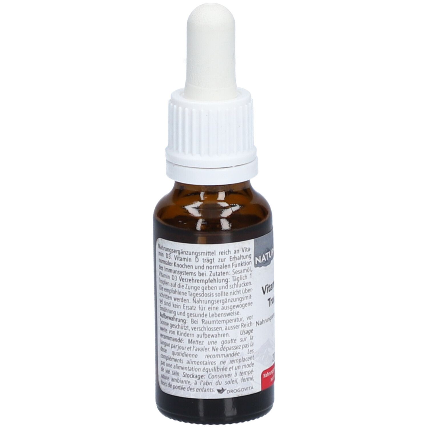 Flacon en verre brun avec compte-gouttes blanc. Texte au dos. Inscription: Vitamin D3 Tropfen. Fabriqué en Suisse.