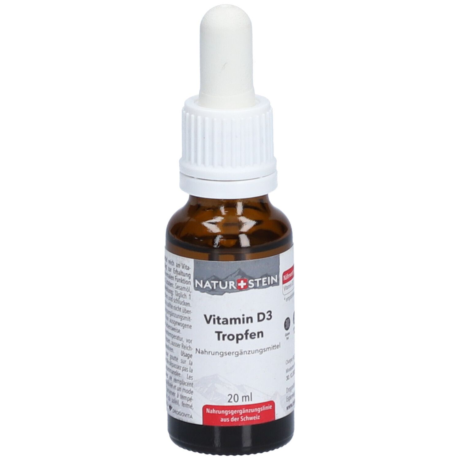 Flacon en verre brun avec compte-gouttes blanc. Inscription: NATUR+STEIN Vitamin D3 Tropfen. 20 ml.