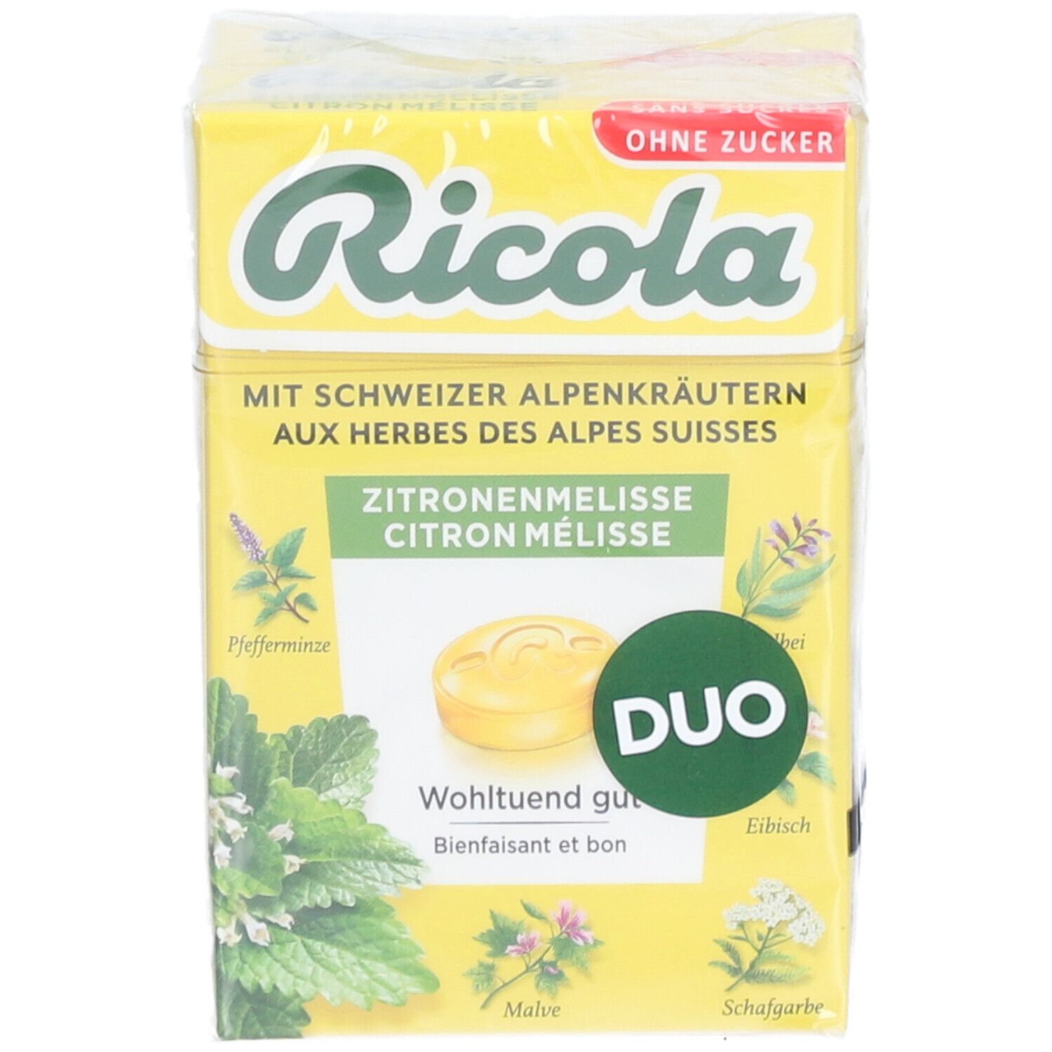 Gelbe Duo-Packung Ricola-Bonbons. Aufdruck: Zitronenmelisse, Kräuter, ohne Zucker. Abbildung von Kräutern und Bonbon. Duo-Logo.