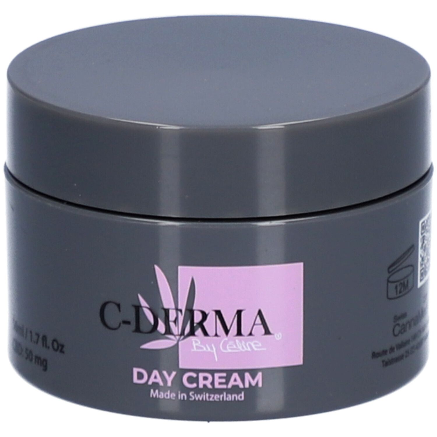 Dunkelgrauer Tiegel mit Deckel. Aufschrift: C-DERMA By Celine, Day Cream. Rosa Feld mit Logo. Hergestellt in der Schweiz.