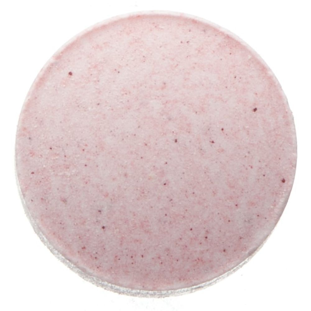 Nahaufnahme einer runden, rosa Tablette. Die Tablette hat eine leicht unebene Oberfläche.