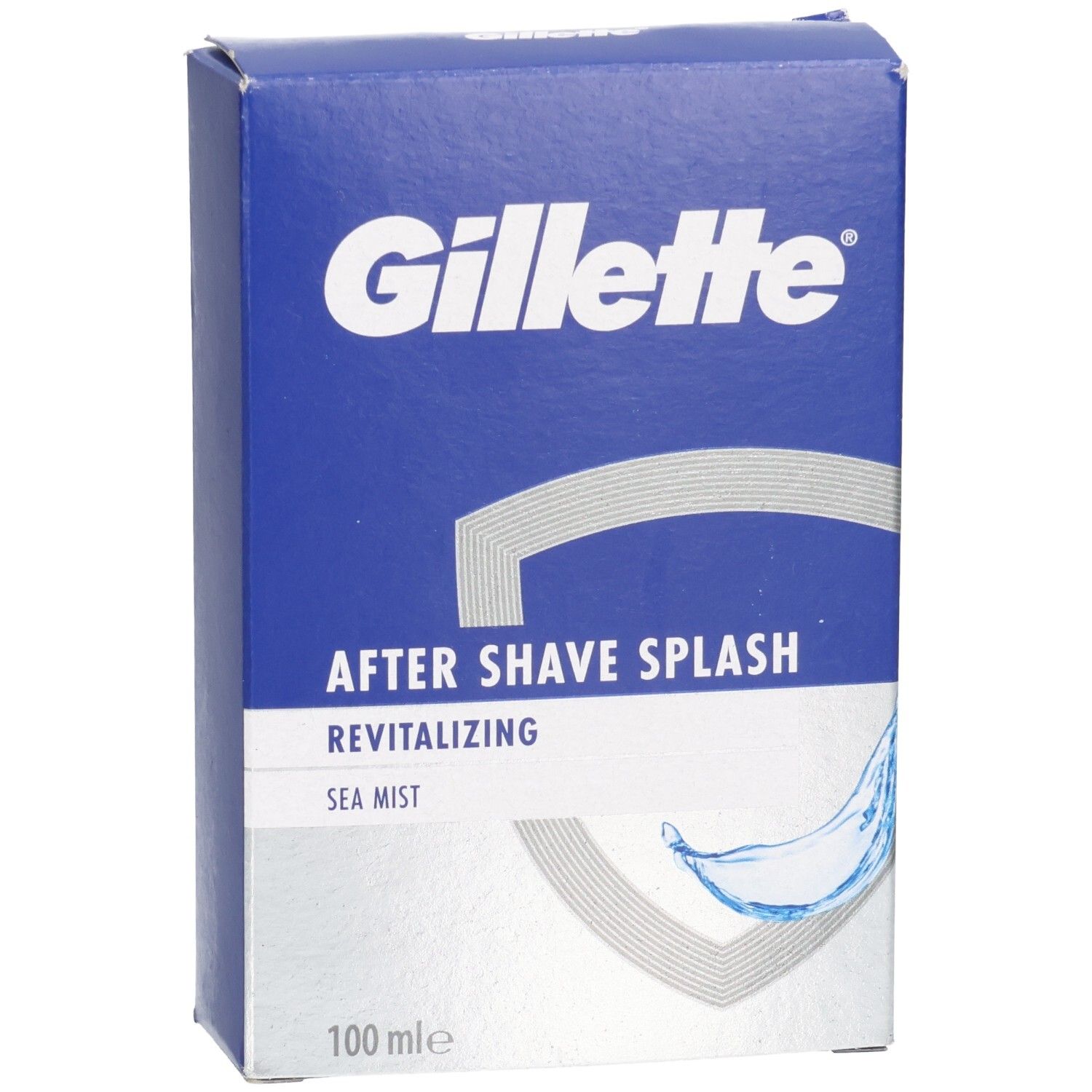 Blaue Schachtel mit Gillette-Logo. "AFTER SHAVE SPLASH" und "Sea Mist" auf silbernem Feld. Graue Wellen-Grafik. "100 mle".