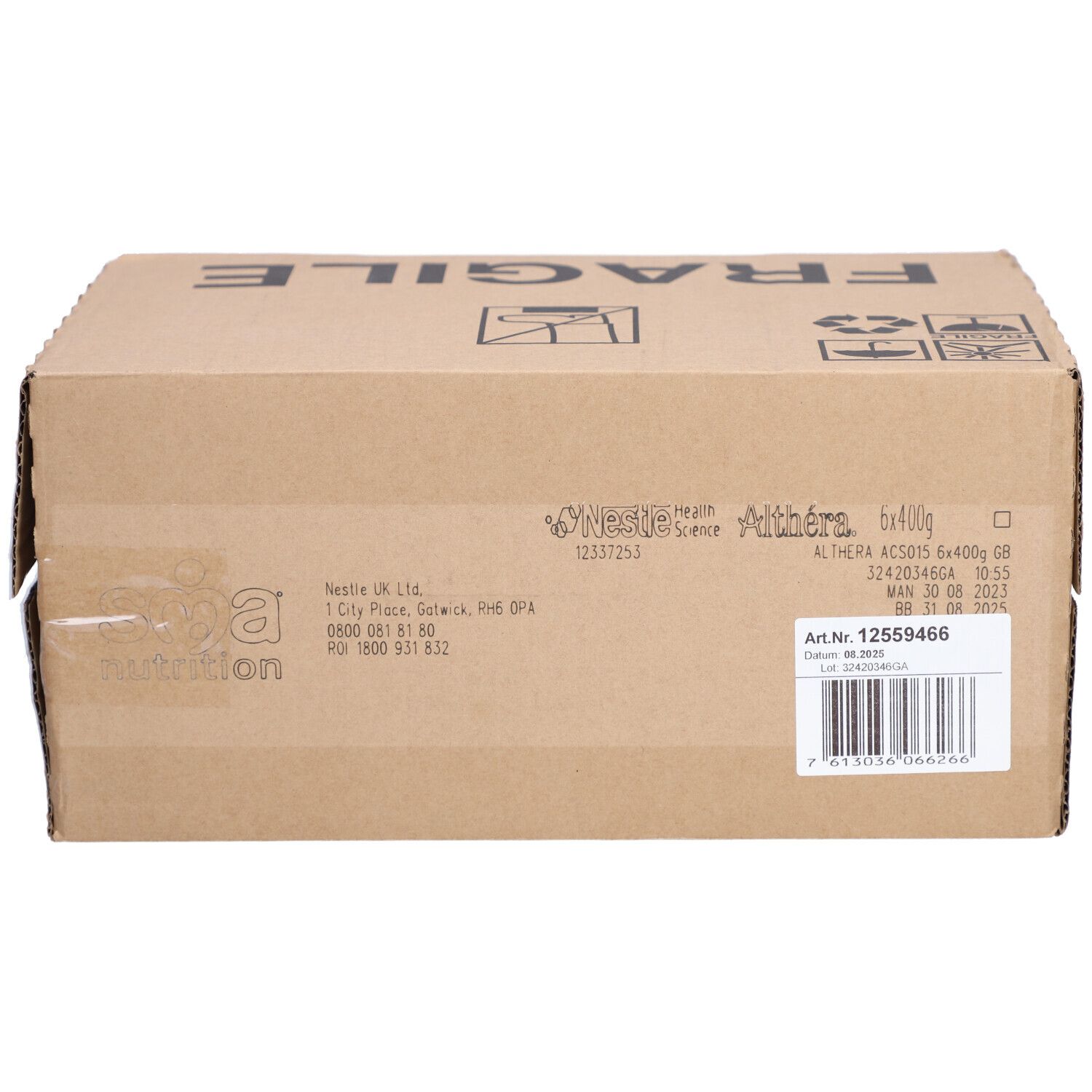 Karton mit Aufdrucken, darunter "FRAGILE" und Produktinformationen. Aufschrift "ALTHERA 6x400g GB".
