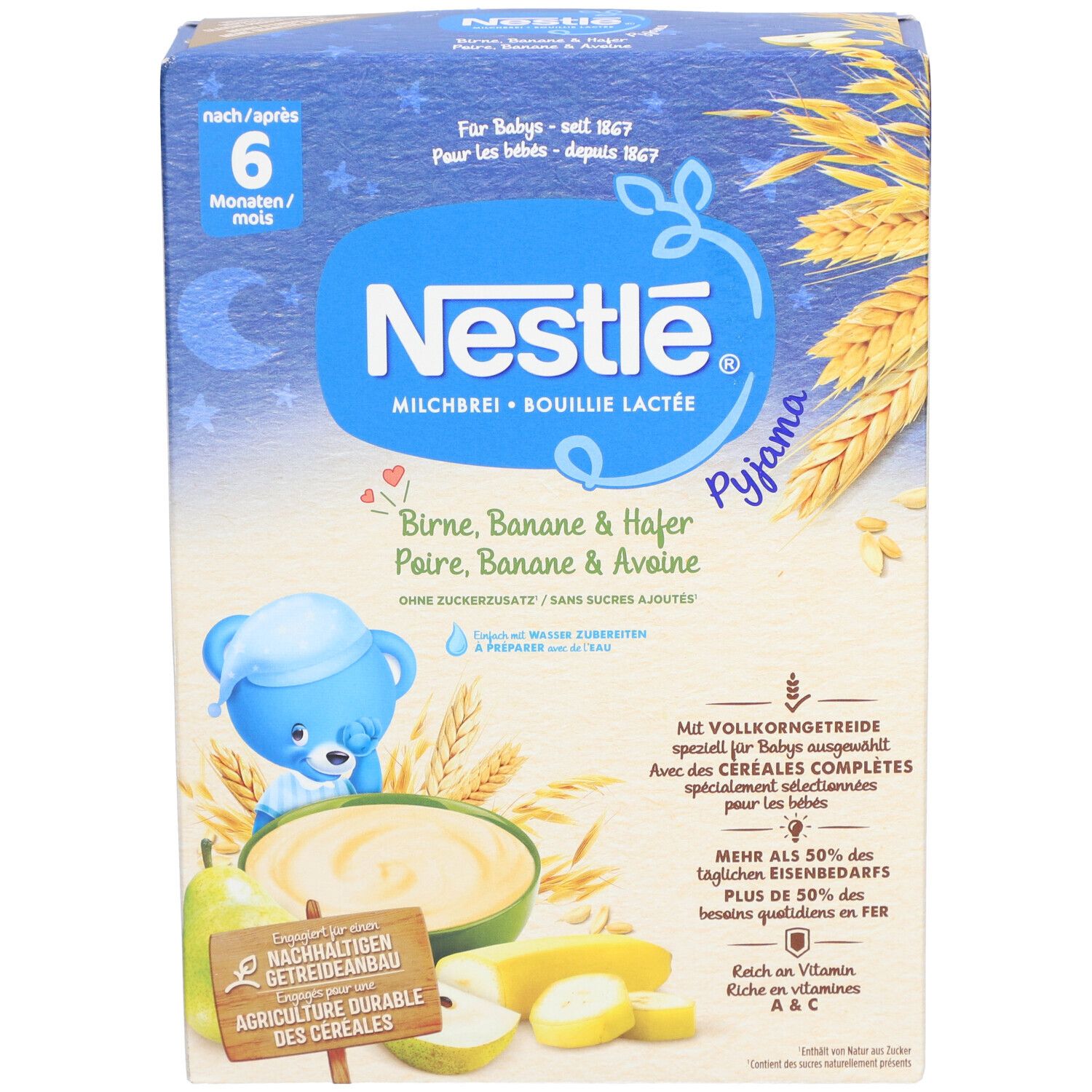 Nestlé Milchbrei-Packung. Blaue Box mit Produktnamen und Illustrationen von Birne, Banane und Hafer. Text: ab 6 Monaten.
