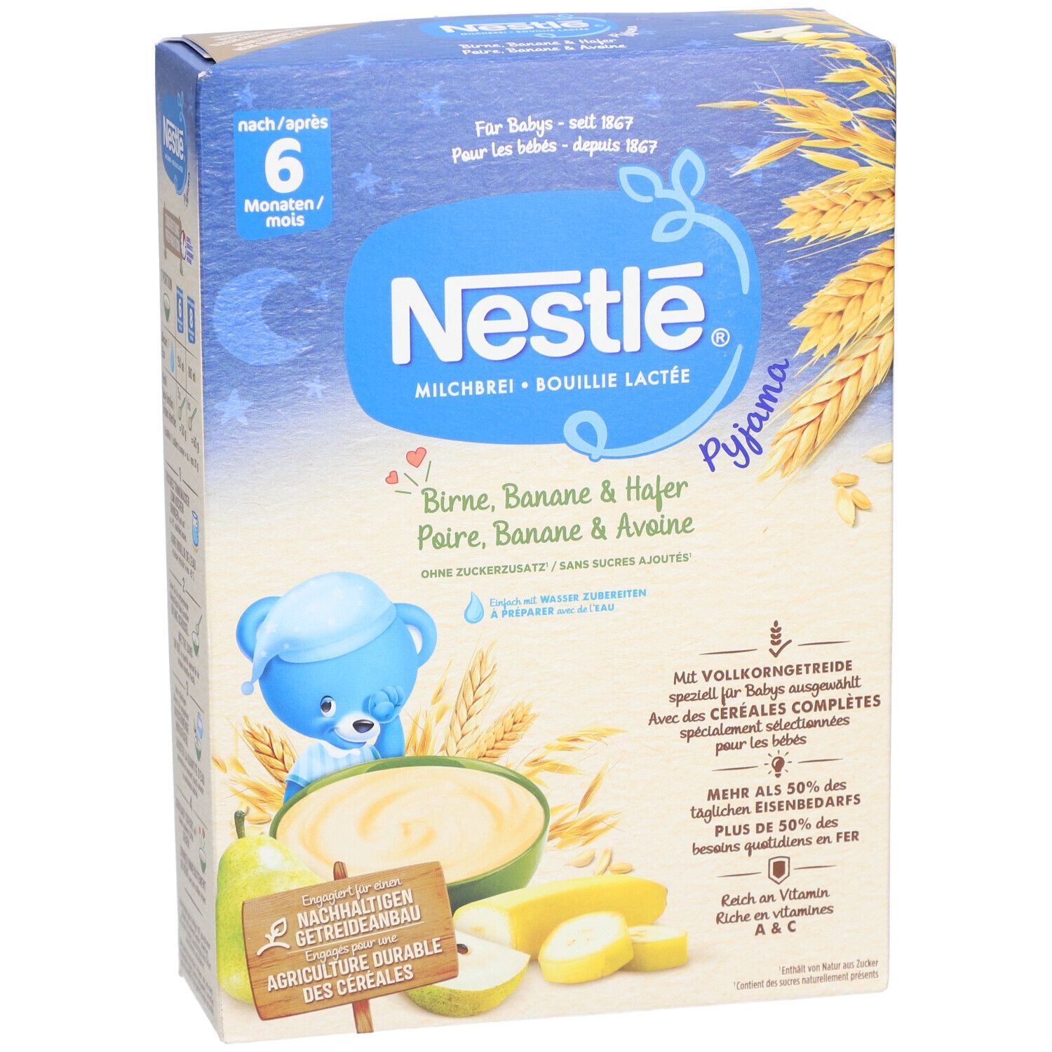 Nestlé Milchbrei-Packung. Blaue Box mit Produktnamen und Illustrationen von Birne, Banane und Hafer. Text: ab 6 Monaten.