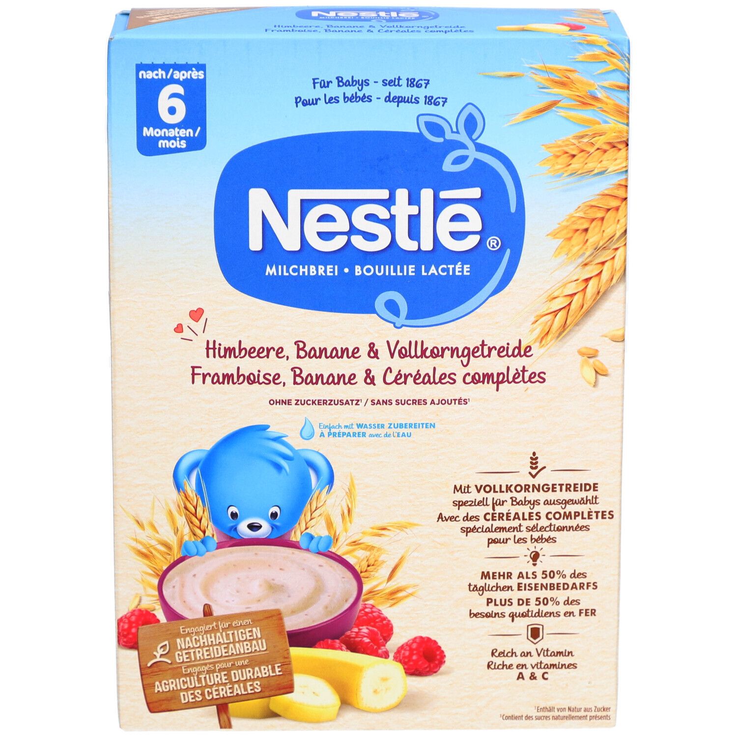 Nestlé Milchbrei-Packung. Blaue Verpackung mit Produktnamen und Illustrationen von Himbeeren, Bananen und Getreide. Altersempfehlung: 6M+.