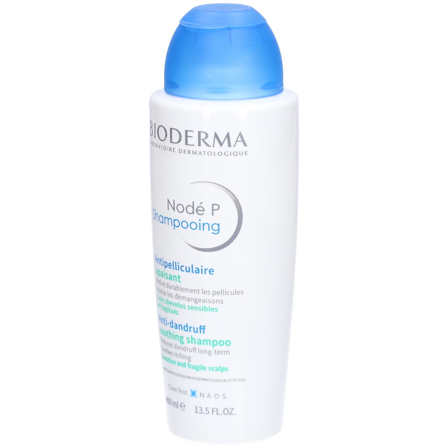 Bioderma Nodé P Shampooing, weiße Flasche mit blauem Deckel. Produktetikett mit Text in mehreren Sprachen.
