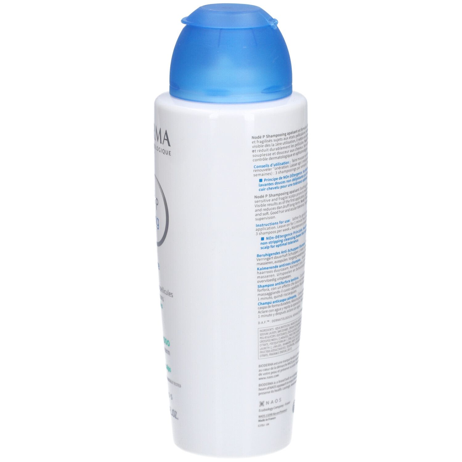 Rückseite der Bioderma Nodé P Shampooing Flasche. Text in mehreren Sprachen, QR-Code und Symbole.