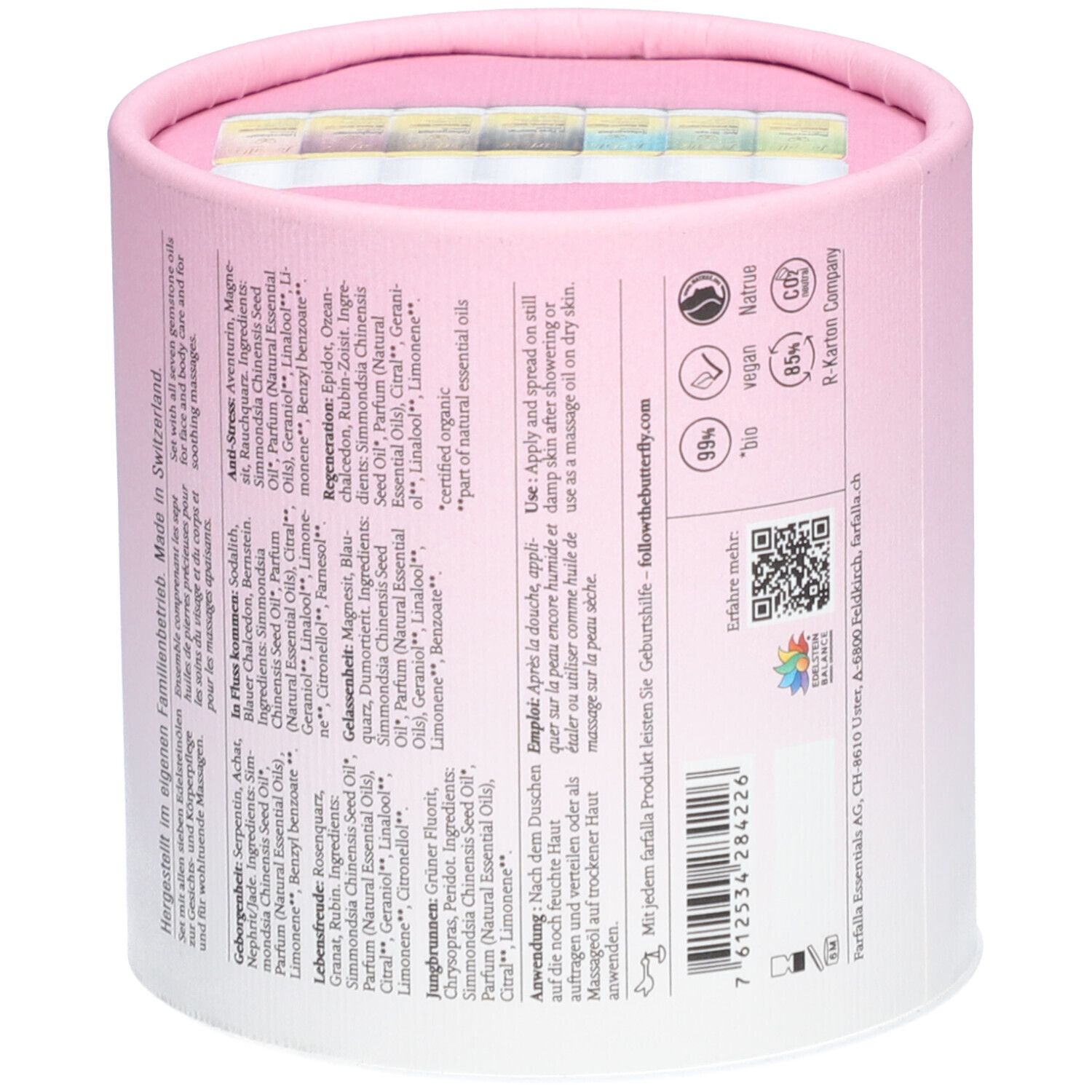 Cilindrische verpakking, roze-wit. Achterkant met tekst en QR-code. Bevat kleine flesjes. Opschrift: farfalla.