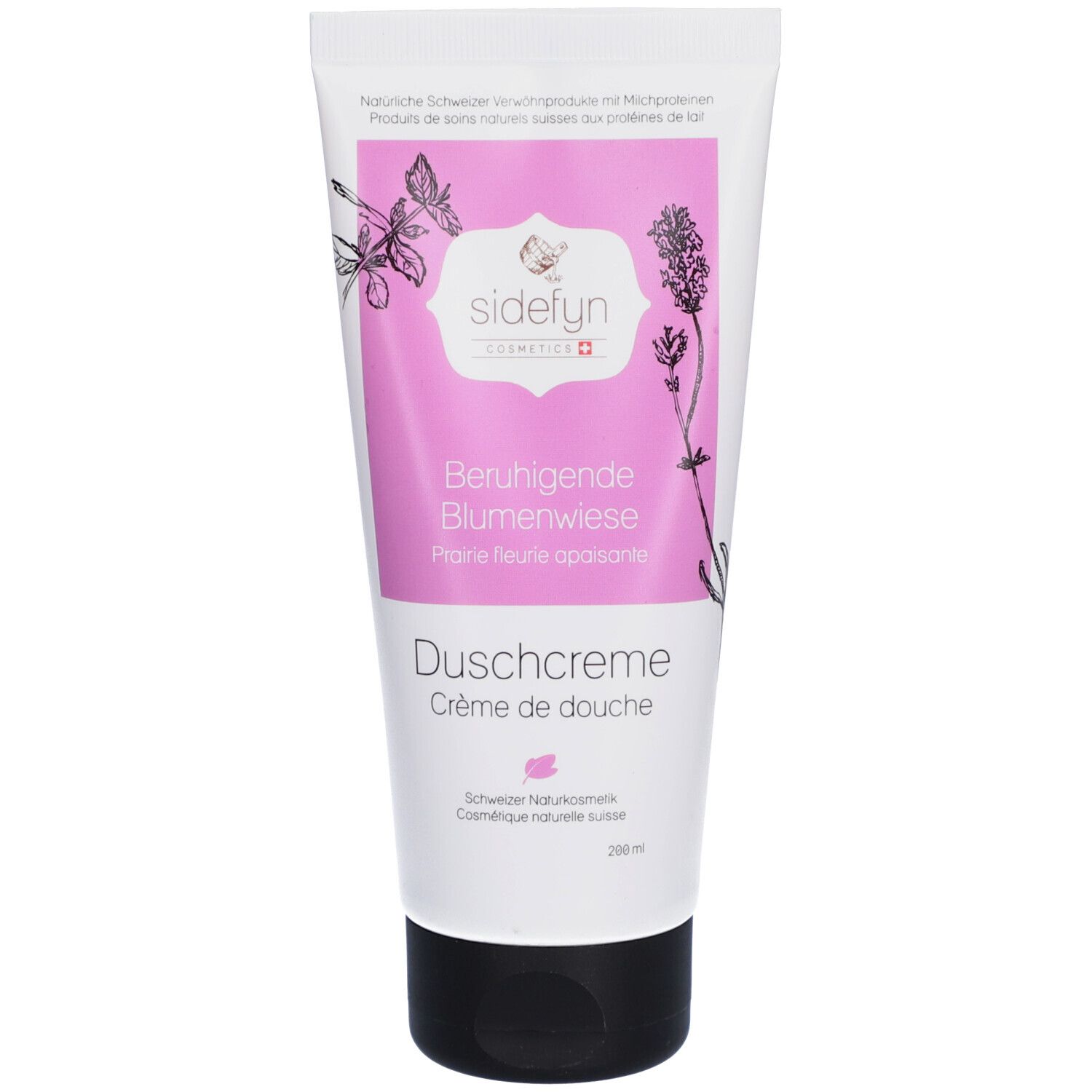 Tube mit Sidefyn Duschcreme. Rosa Etikett mit Produktnamen und floralen Illustrationen. Schwarzer Verschluss.