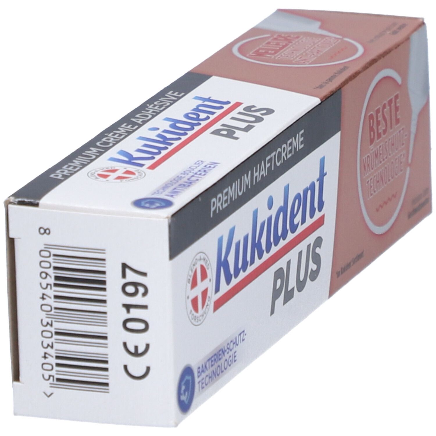 Boîte de crème adhésive. Inscription: Kukident PLUS, Premium Haftcreme, Technologie de protection antibactérienne. Code-barres et marquage CE.