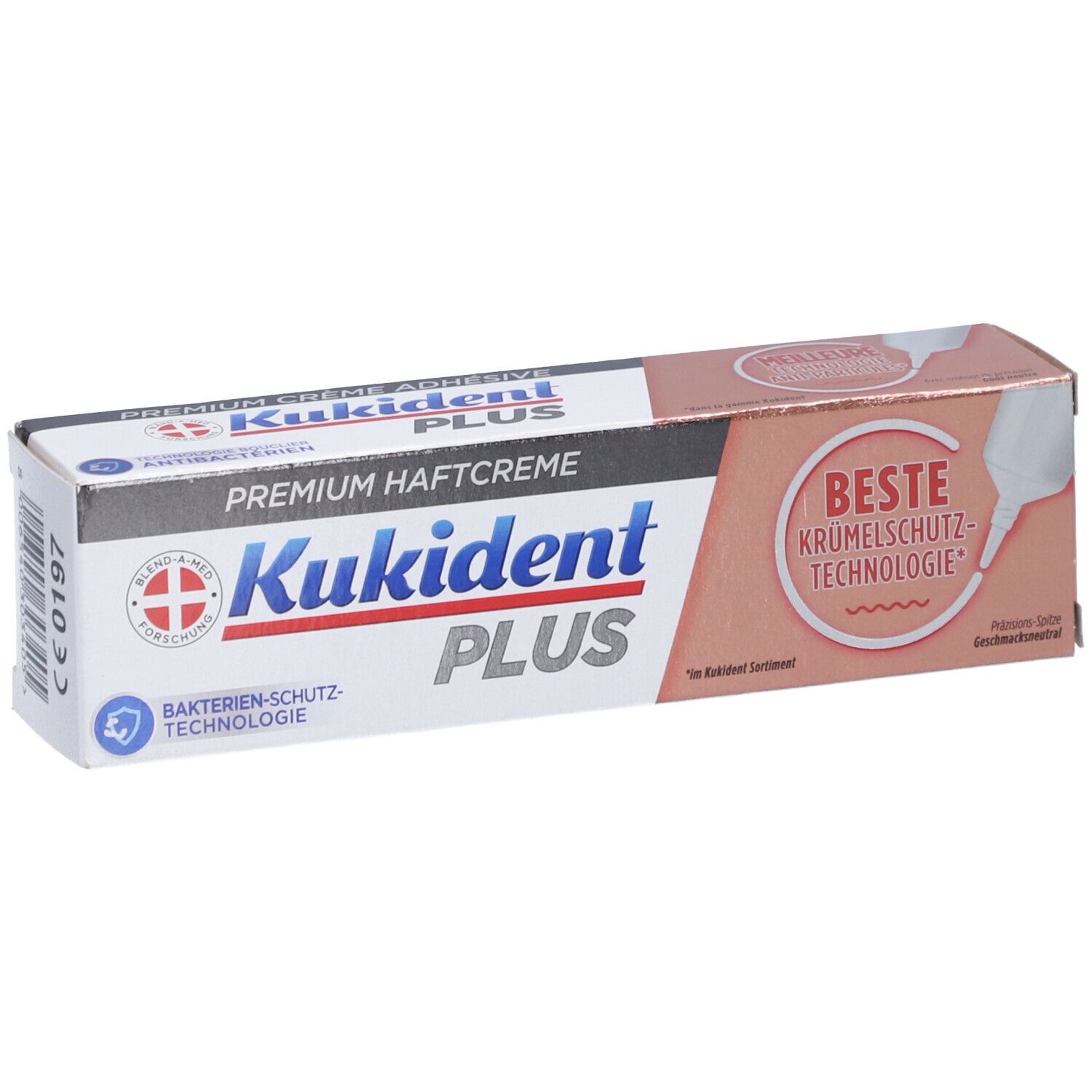Boîte de crème adhésive. Inscription: Kukident PLUS, Premium Haftcreme, Technologie de protection antibactérienne. Meilleure technologie anti-miettes. CE.