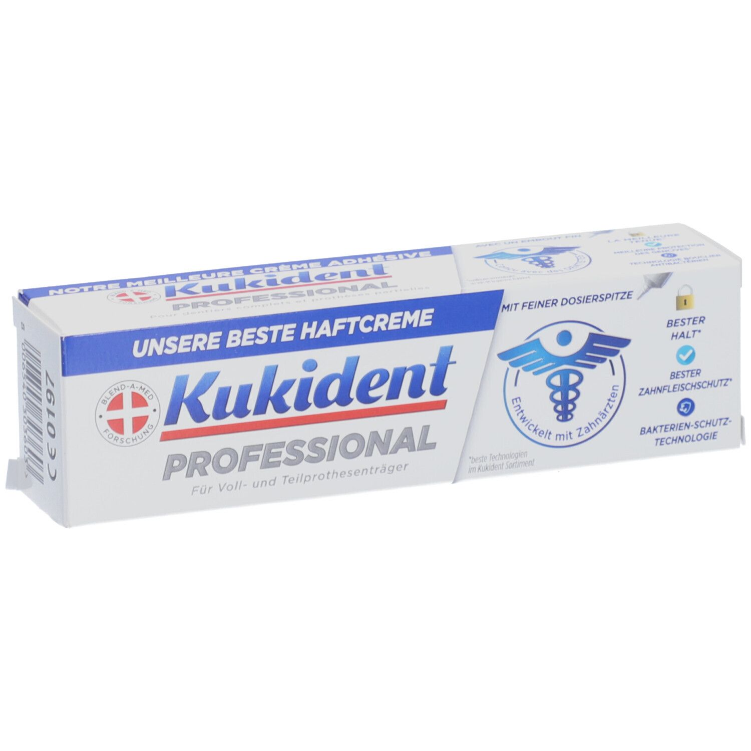 Boîte blanche avec texte bleu. Inscription: Kukident Professional, notre meilleure crème adhésive. Logo avec symbole dentaire.