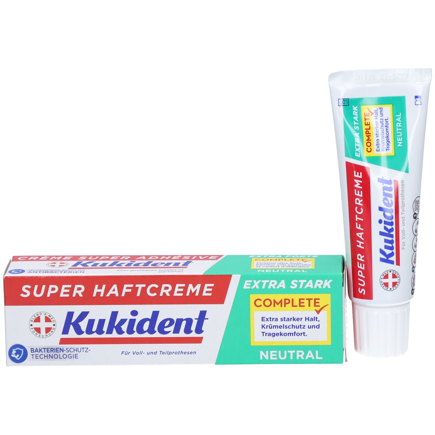 Zahncremetube und Schachtel. Aufschrift "Kukident Super Haftcreme Extra Stark neutral". Logo und Schweizer Kreuz.