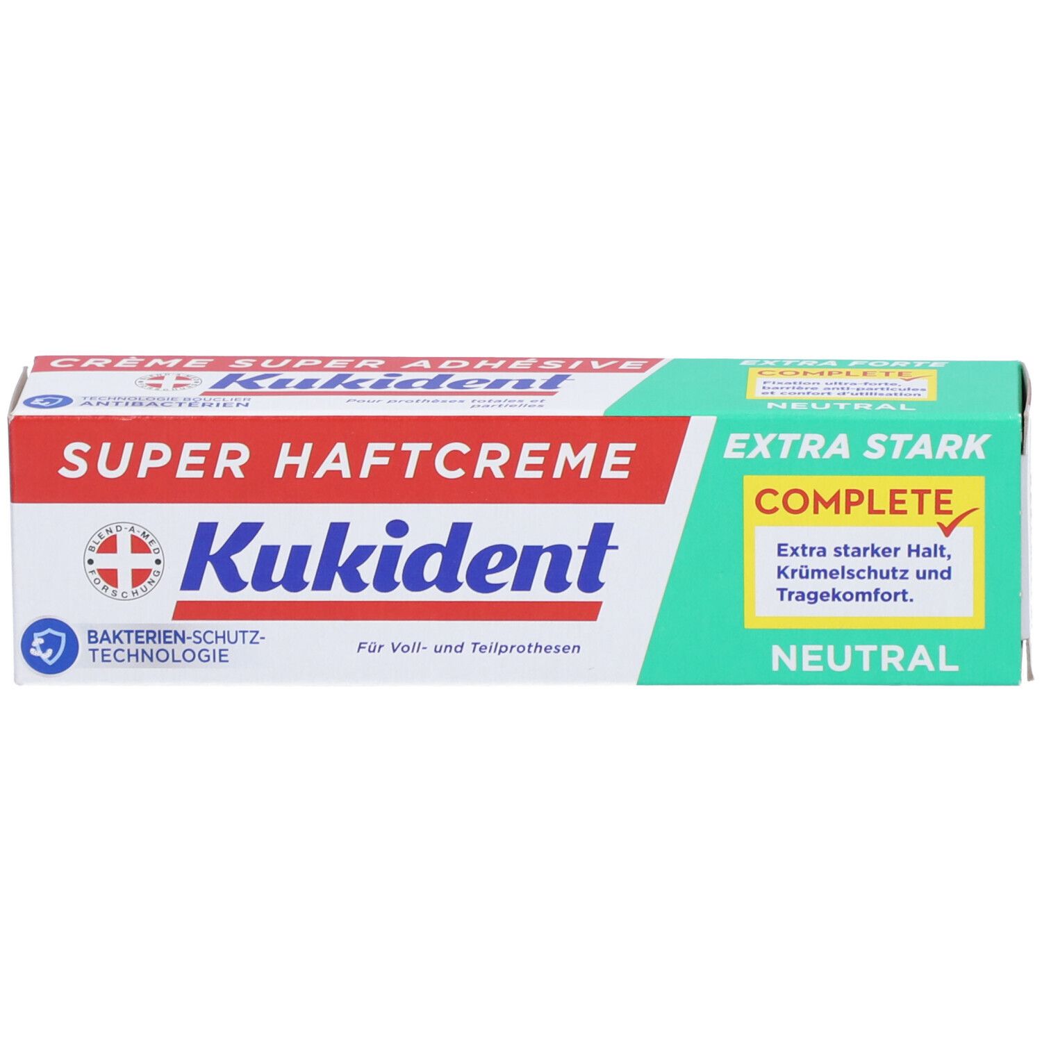 Schachtel mit "Kukident Super Haftcreme Extra Stark neutral". Logo und Schweizer Kreuz. Grün-weiß-rote Farbgebung.