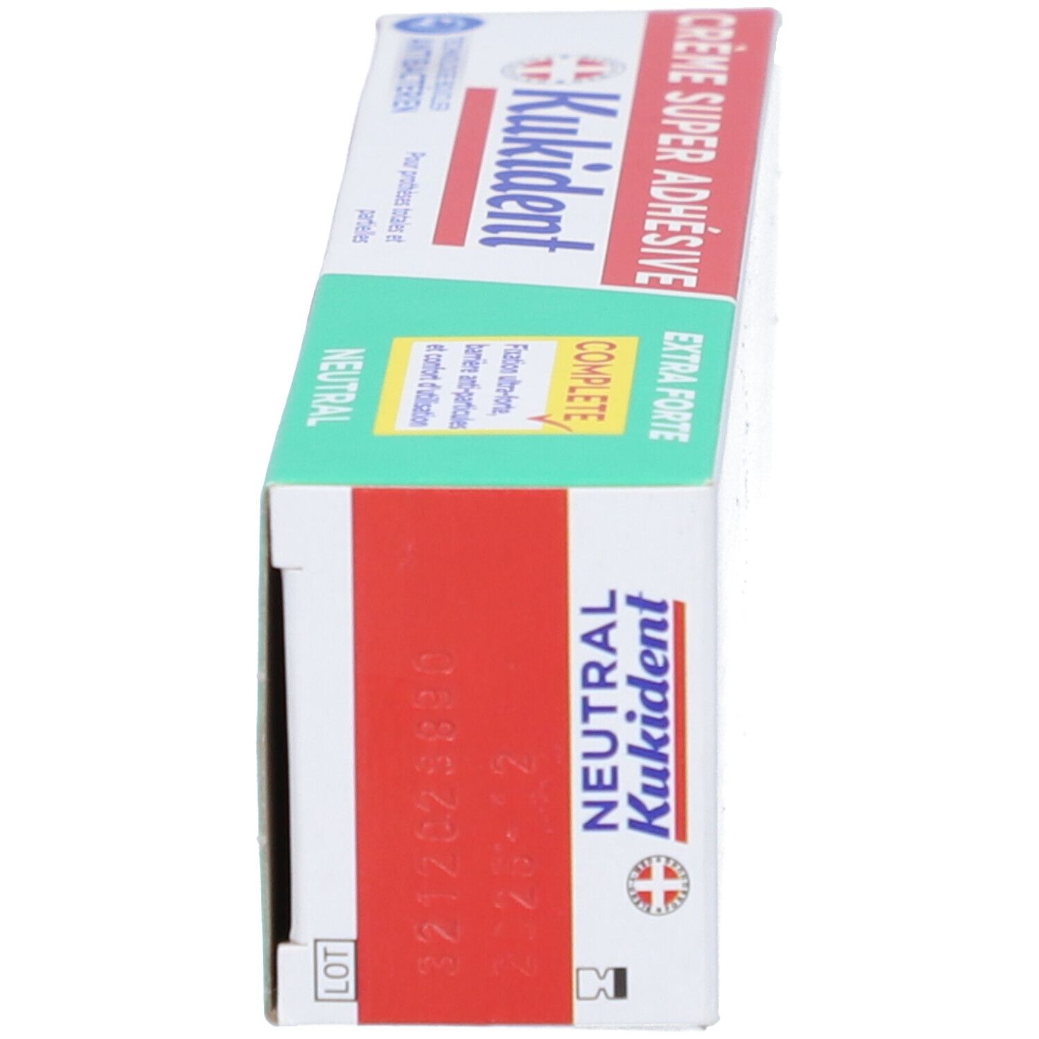 Schachtel, Seitenansicht. Aufschrift "Kukident Super Haftcreme Extra Stark neutral". Logo und Schweizer Kreuz.
