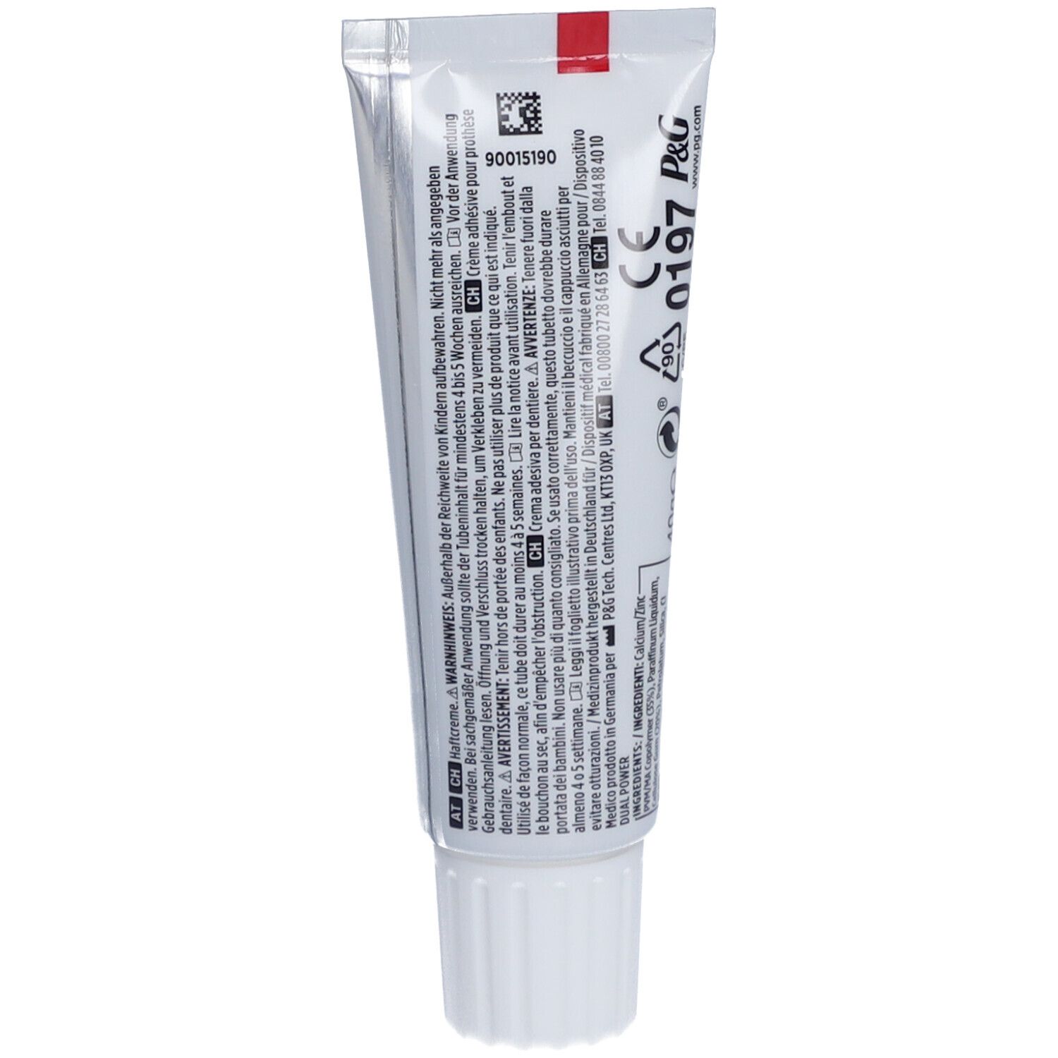Rückseite der Haftcreme-Tube. Mehrsprachiger Text, Barcode, CE-Kennzeichnung und Herstellerinformationen.