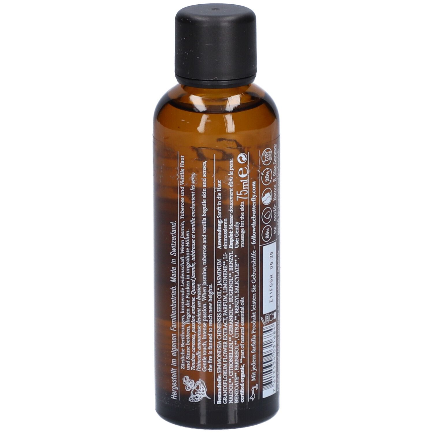 Braune Glasflasche mit schwarzem Deckel. Detailansicht der Rückseite mit Text.