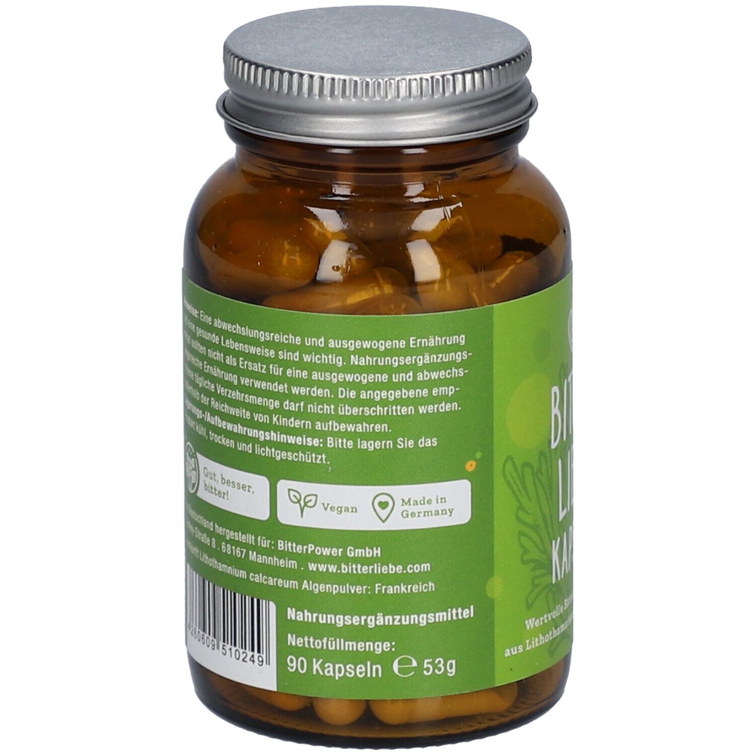Rückseite der braunen Glasflasche mit Kapseln. Grünes Etikett mit Text, Logo, Vegan-Siegel und 'Made in Germany'.
