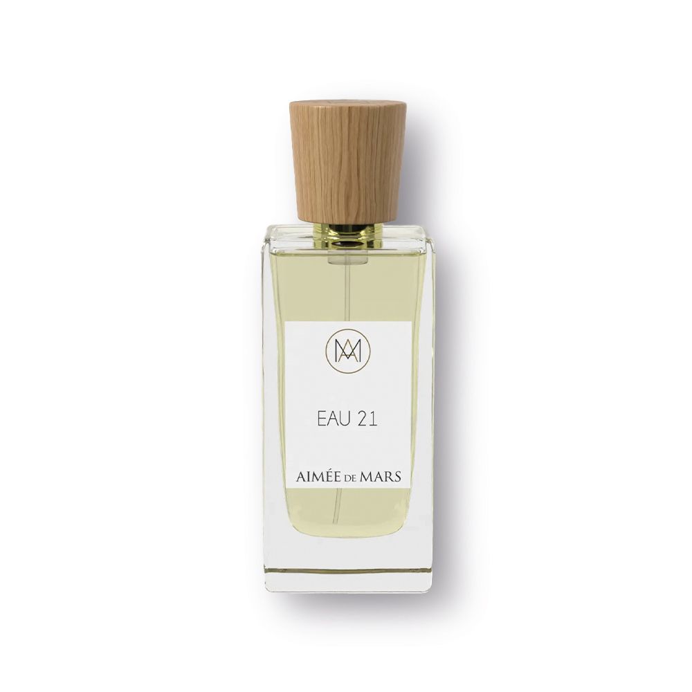 Aimée de Mars Eau 21 Eau de Parfum. Glasflakon mit Holzverschluss. Weißes Etikett mit Logo und Produktbezeichnung.