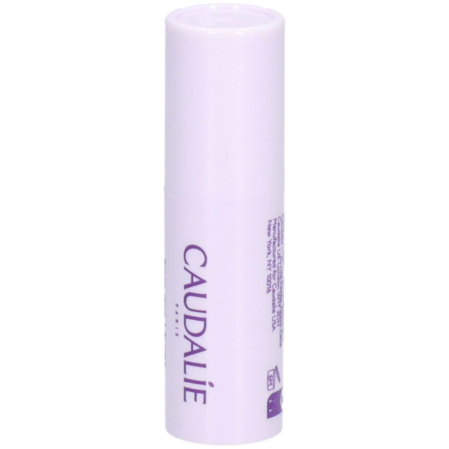 Stick à lèvres en étui blanc-violet. Inscription CAUDALIE. Texte: Manufactured for CAUDALIE USA, New York.