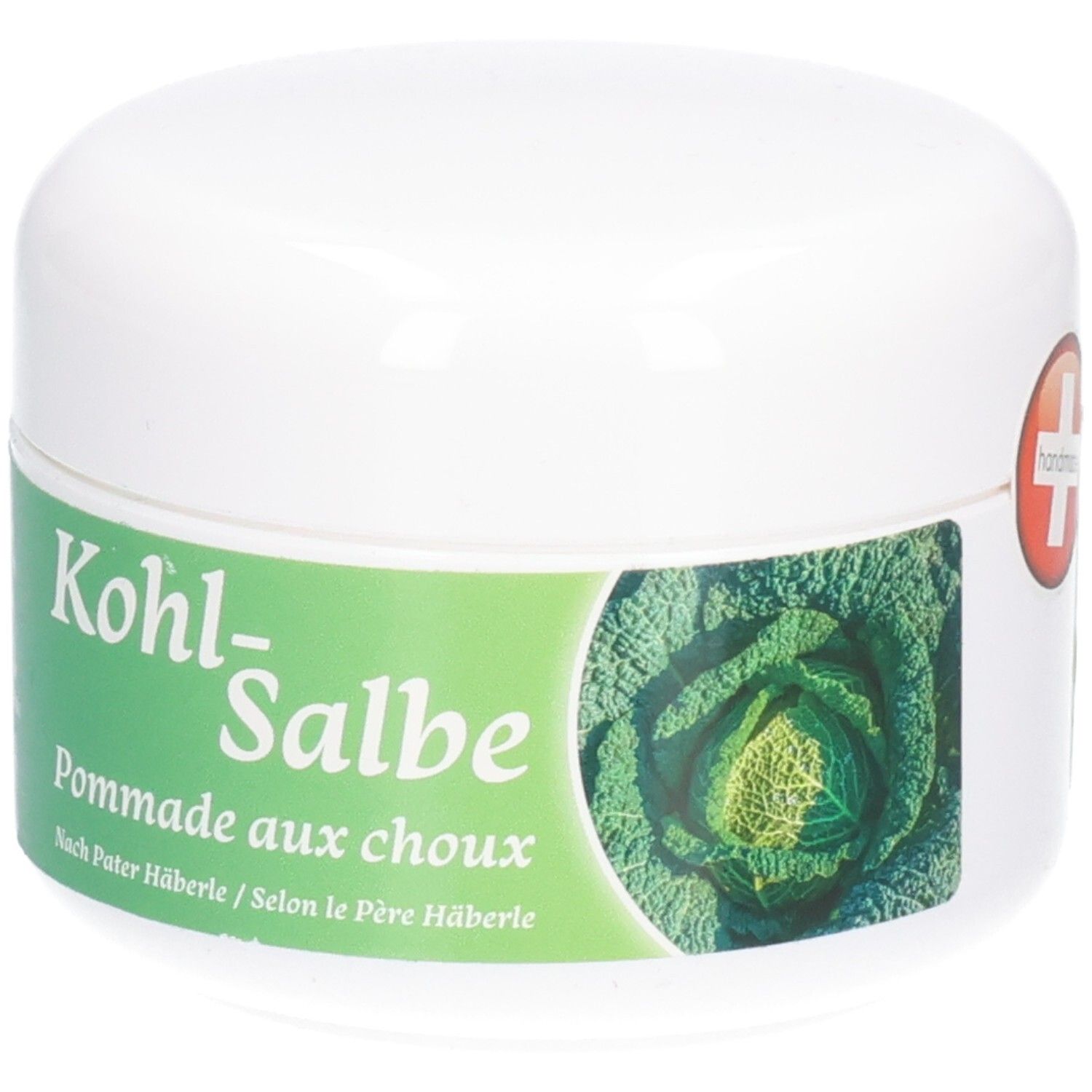 Weißer Tiegel mit grünem Etikett. Schweizer Kreuz und Aufschrift: handmade. Aufschrift: Kohl-Salbe, Pommade aux choux.