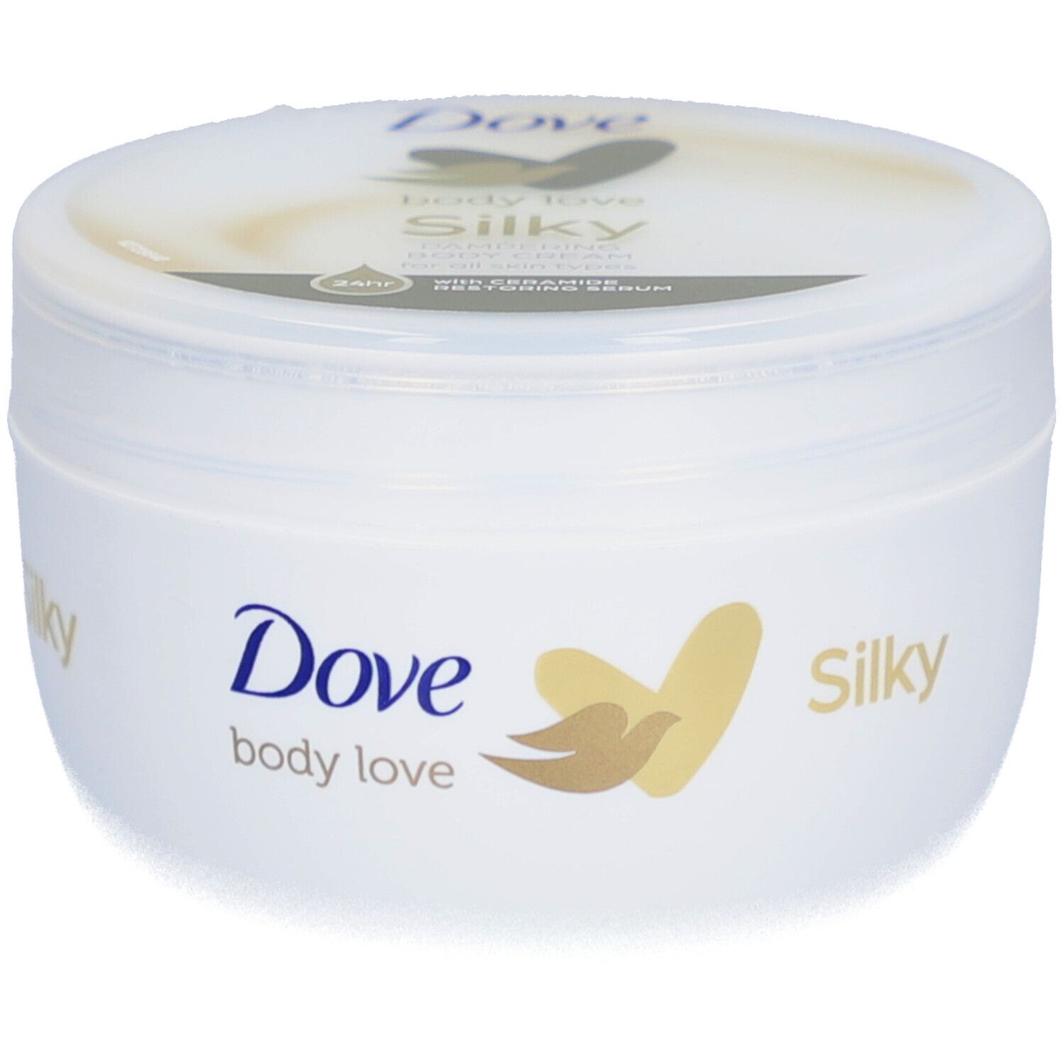 Pot blanc avec logo Dove et inscription "Silky". Couvercle avec nom du produit. Logo doré.