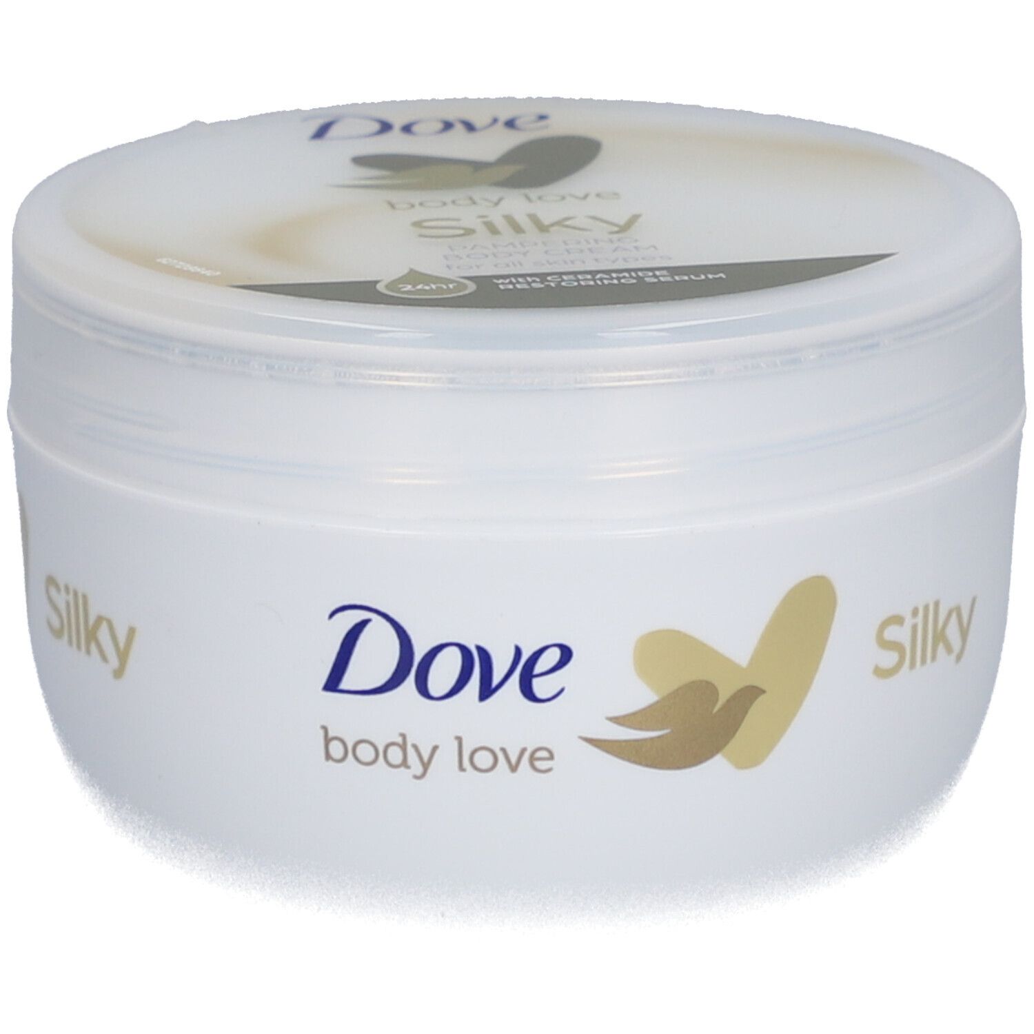 Pot blanc avec logo Dove et inscription "Silky". Couvercle avec nom du produit. Logo doré.