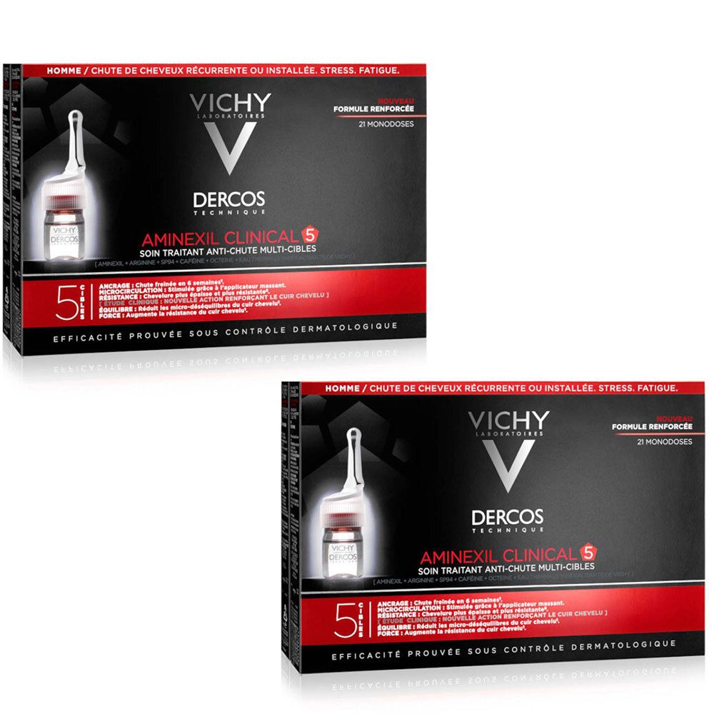 Zwei Packungen Vichy Dercos Aminexil Clinical 5. Schwarze Schachteln mit roter Schrift. Sichtbar: Ampulle, Logo, Produktname und Text.