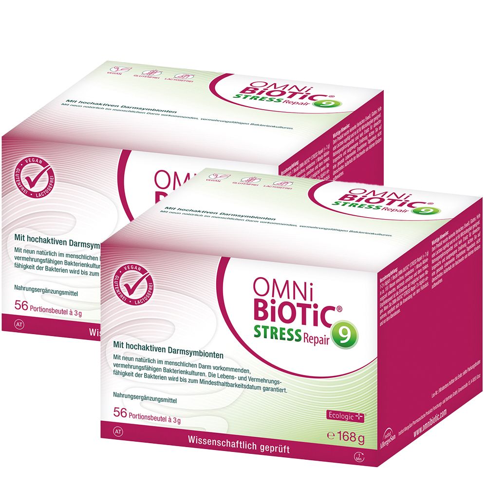 Zwei Packungen OMNi BiOTiC® Stress-Repair. Weiße Kartons mit pinkfarbenen Akzenten und Produktnamen. Vegan-Logo sichtbar.
