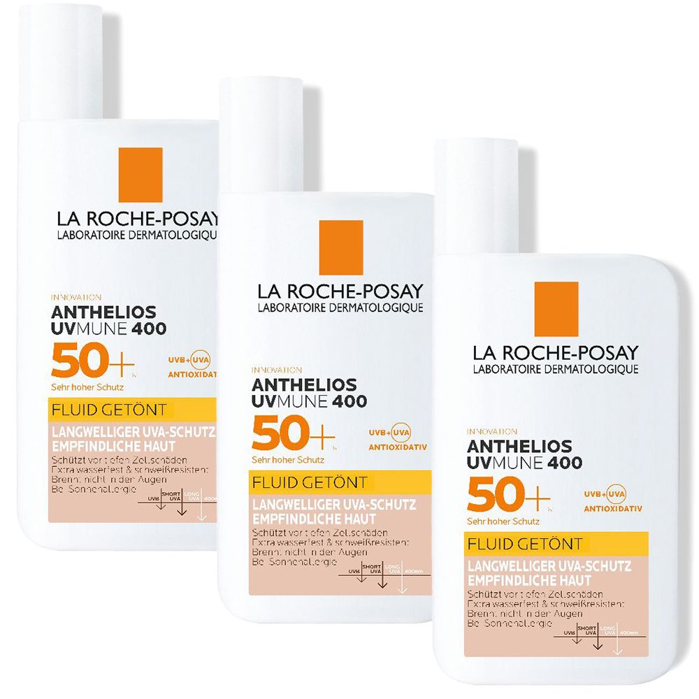 Drei Flaschen La Roche-Posay Anthelios UVMune 400 LSF 50+ Fluid Getönt. Weiße Flaschen mit orangefarbenem Quadrat und Produktinformationen.