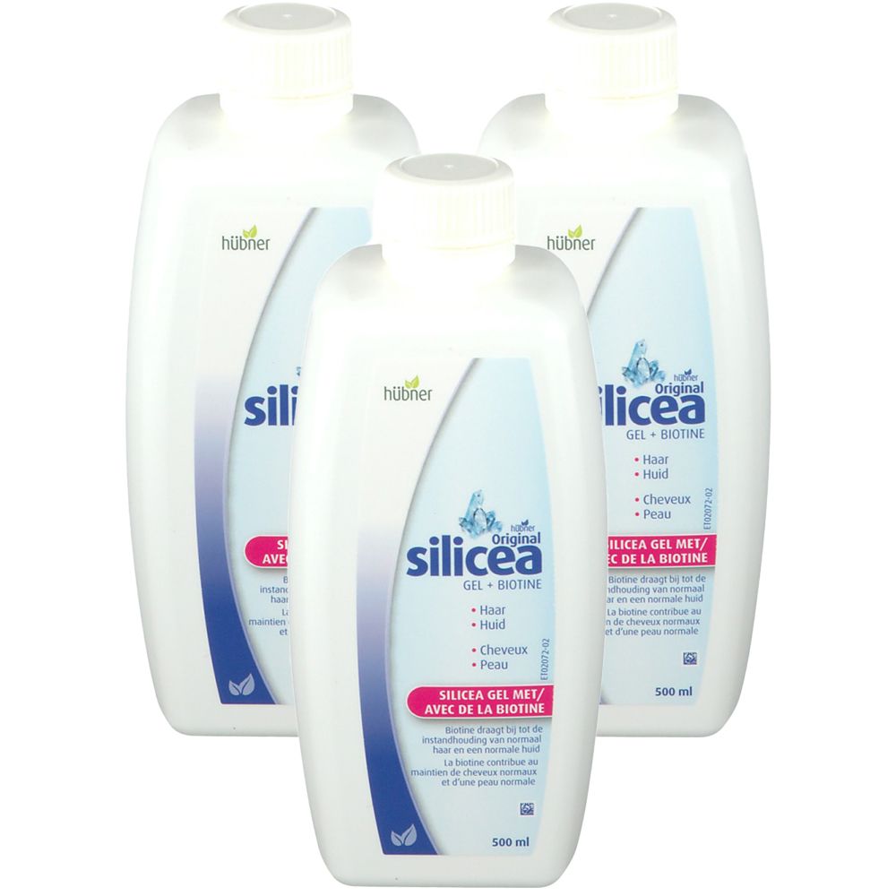 Trois flacons blancs avec bouchons à vis. Les étiquettes indiquent "Original Silicea Gel + Biotine".
