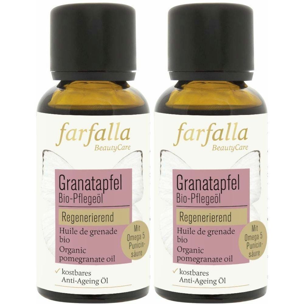 Zwei Flaschen Granatapfel Bio-Pflegeöl. Schwarze Kappe, transparente Flasche mit gelblicher Flüssigkeit. Etikett mit Produktinformationen.