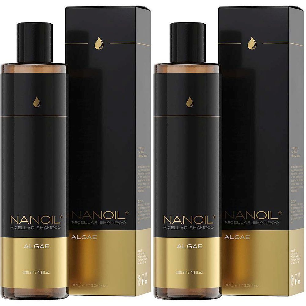 Zwei Flaschen und zwei Schachteln NANOIL Algen-Micellar-Shampoo. Schwarze Flaschen mit goldenen Akzenten. Aufschrift: NANOIL, ALGAE, Micellar Shampoo.